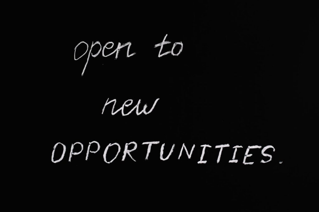 pexels photo 5598293 Blackboard with motivational quote 'Open to New Opportunities' in chalk writing.